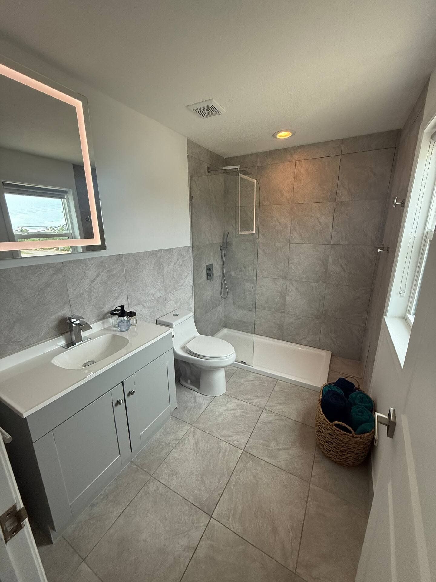 Guest bathroom with tiled walls